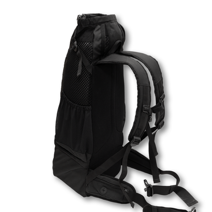 Side view of the Knavigate dog carrier backpack in Midnight Black with the mesh ventilation panel and lap belt visible