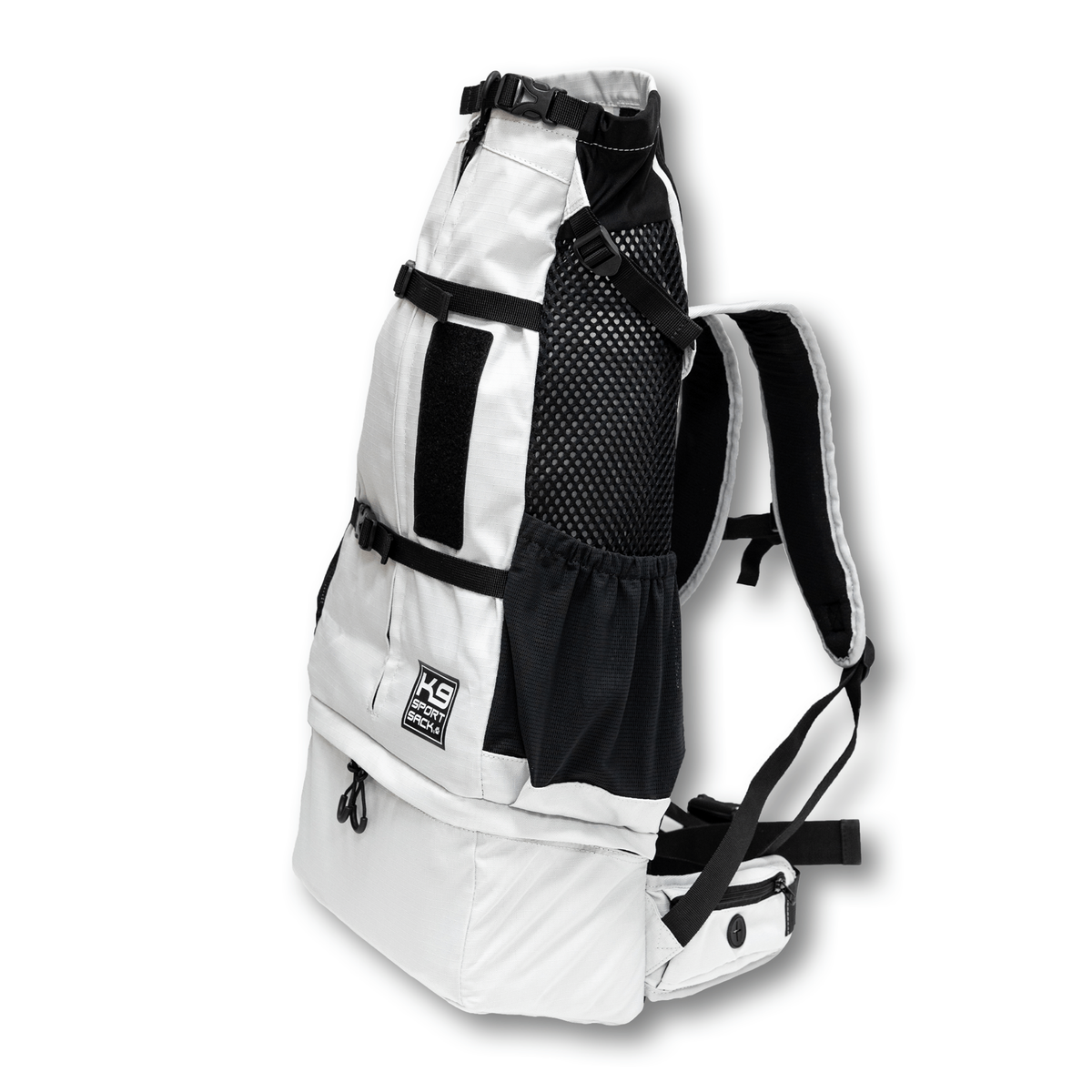Angled view of the Knavigate dog carrier backpack in Lunar Rock with the shoulder straps and mesh side panel visible