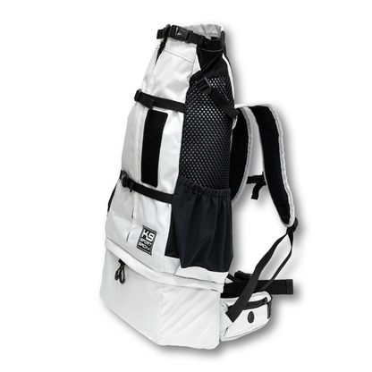 Angled view of the Knavigate dog carrier backpack in Lunar Rock with the shoulder straps and mesh side panel visible